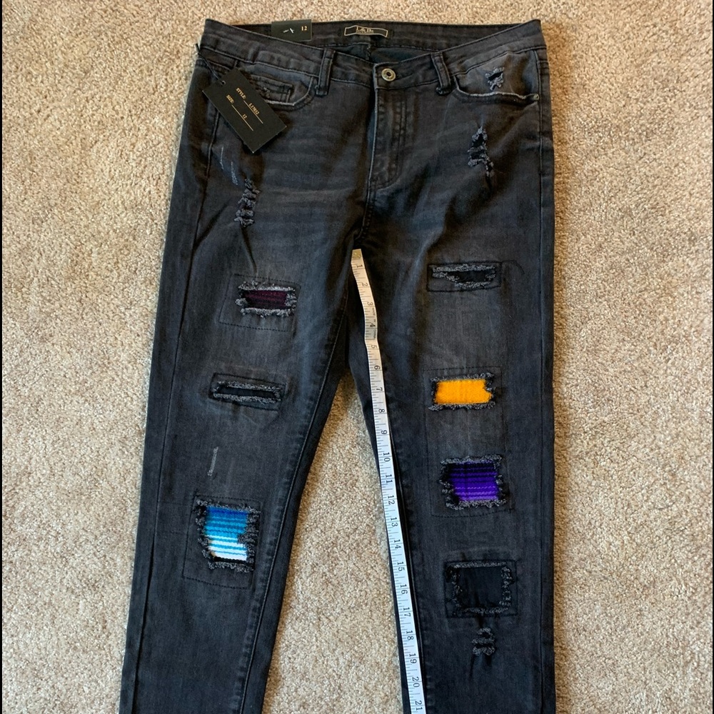 Destroyed jeans with serape panels